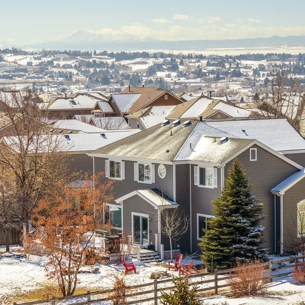 Denver Metro Area Residential Winter Panorama with the view of a Front Range mountains on the distance.
